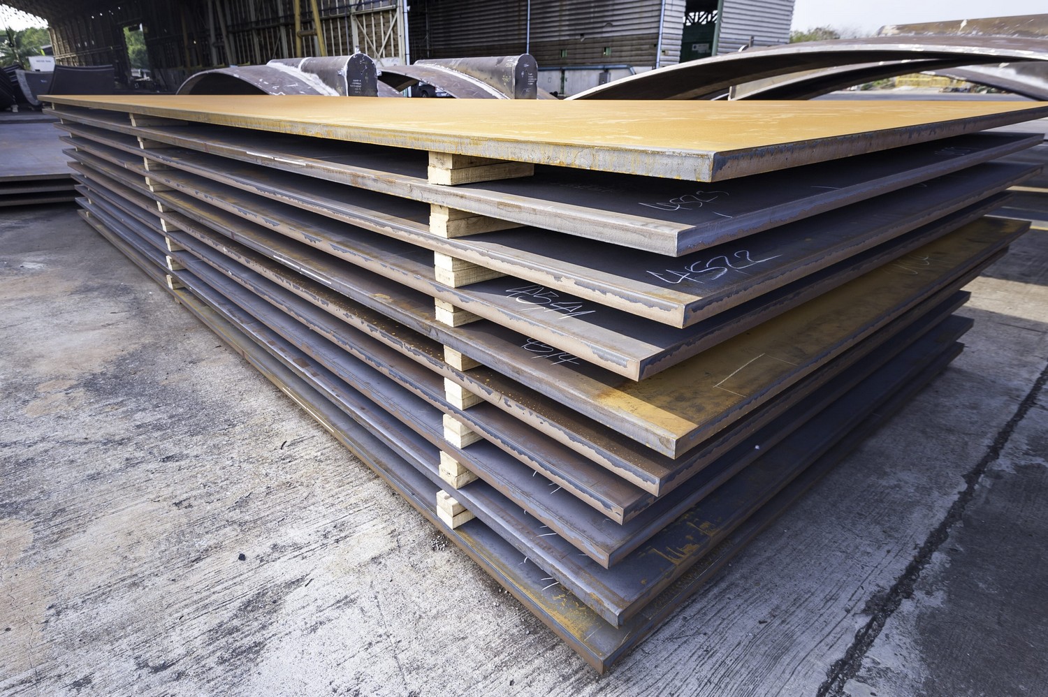 Large steel sheets stacked on top of each other